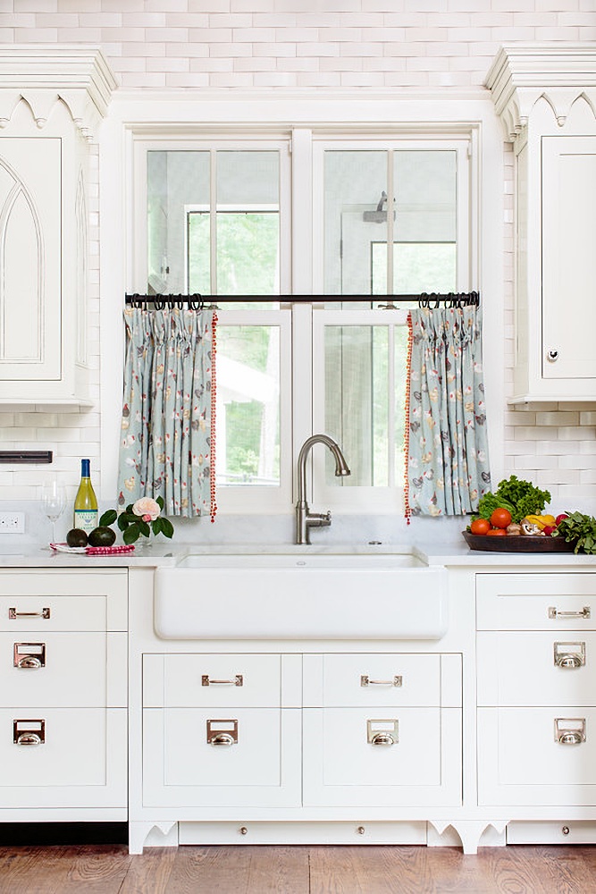 Patterned café curtains in traditional kitchen