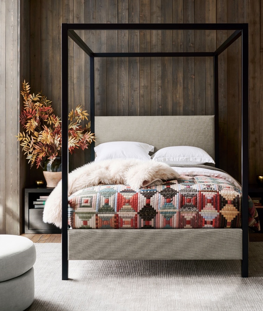 Metal canopy bed and bedding from Pottery Barn