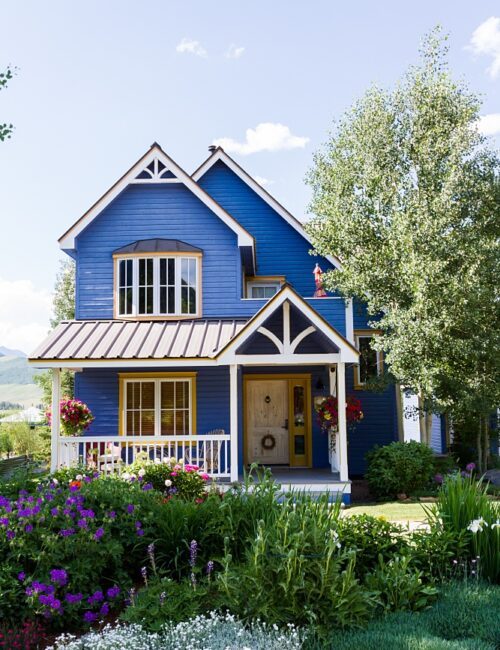 Blue Victorian home with plenty of curb appeal
