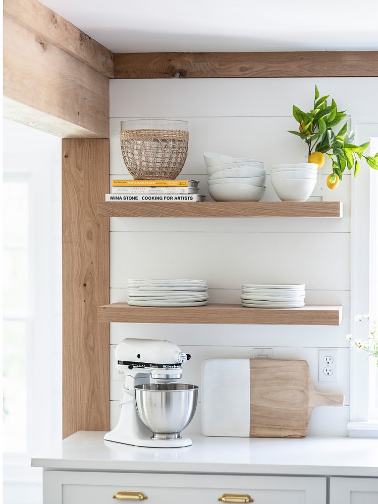 White oak floating shelves in coastal kitchen