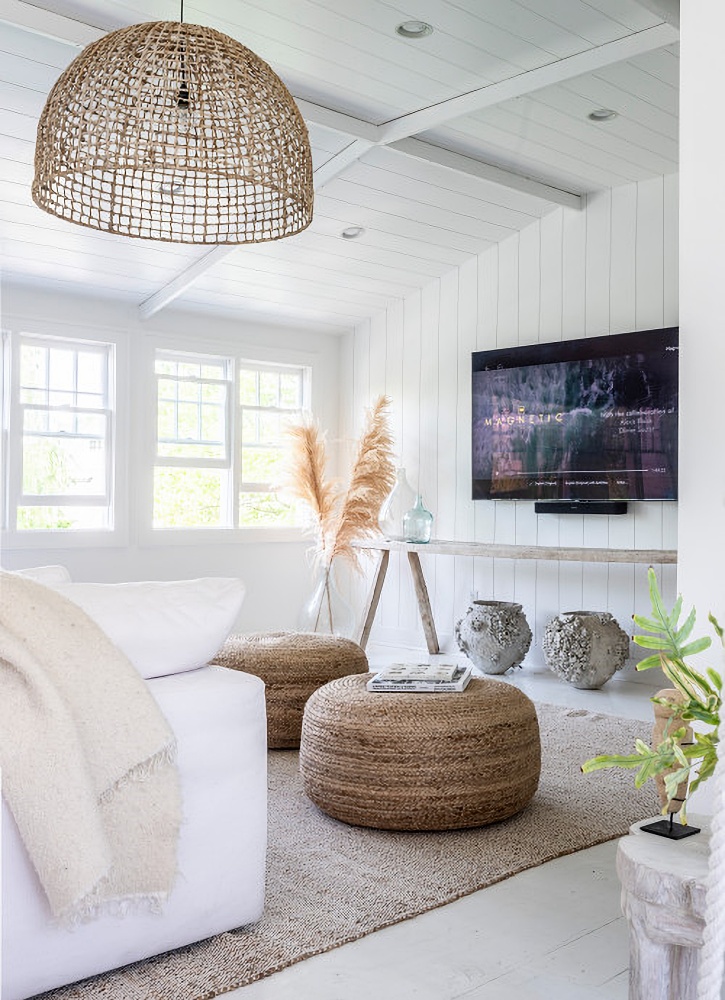 Neutral family room with sisal rug and basket pendant light