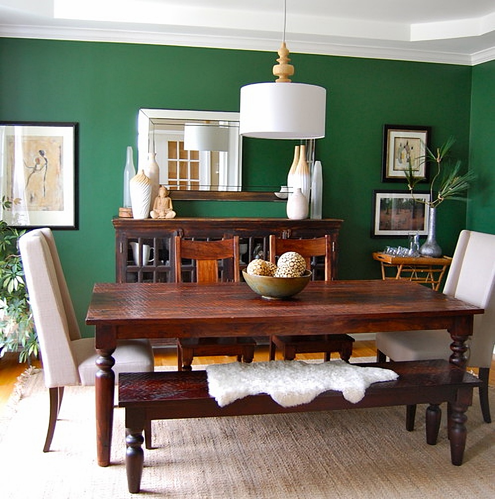 dark wood furniture in green dining room