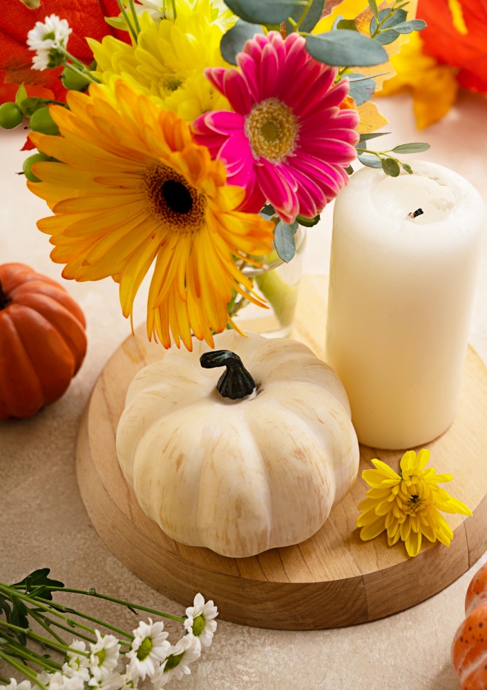 fall florals and baby boo pumpkins with a candle