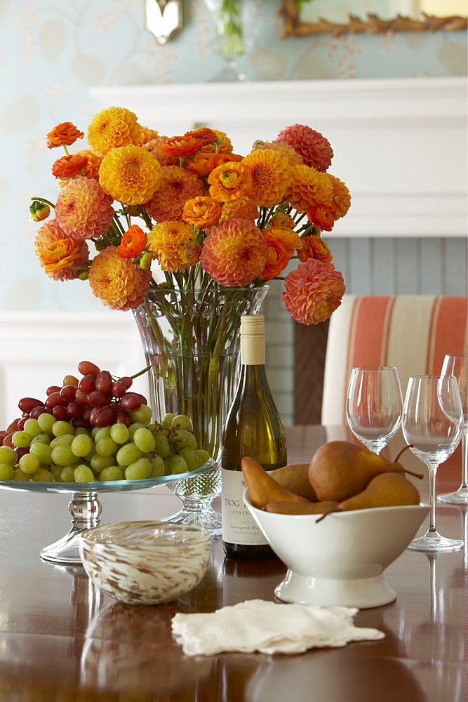 Orange dahlia bouquet on fall table