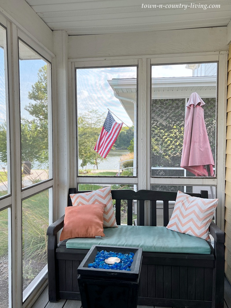Small bench on a screened porch with view of the Illinois River