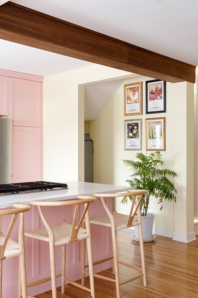 Kitchen peninsula with pink cabinets