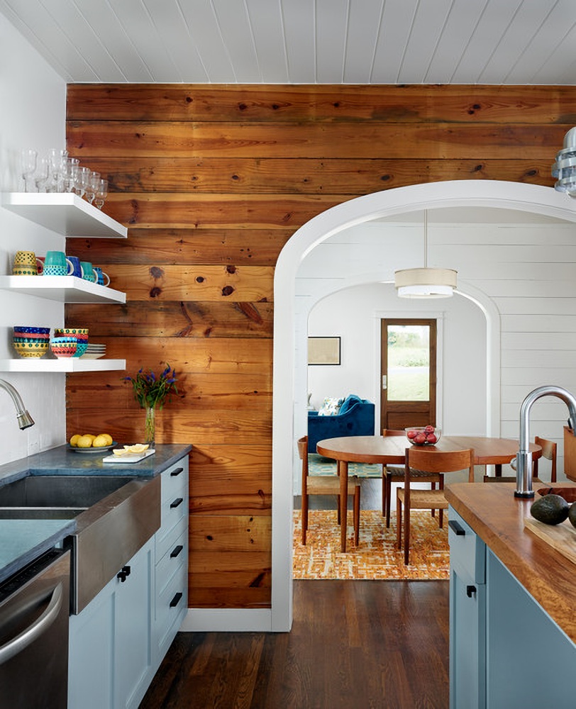 Farmhouse kitchen with horizontal wood paneling on one wall
