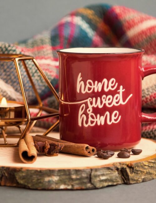 Home Sweet Home mug with candle and plaid blanket