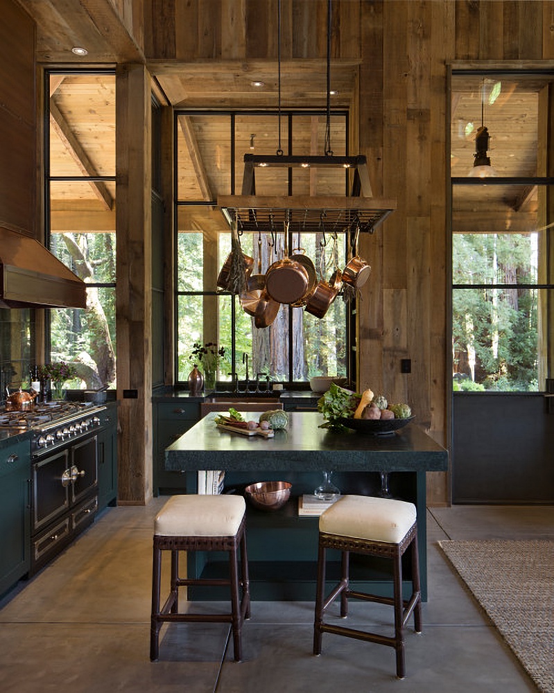 Large rustic kitchen with island and hanging copper pots