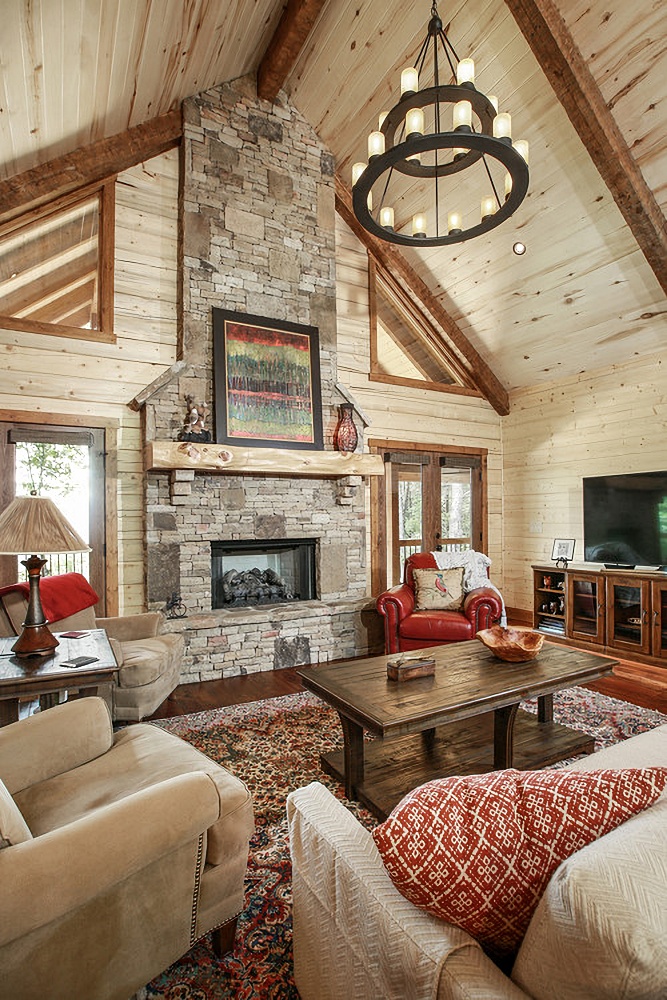 Light wood paneled walls in rustic vaulted living room