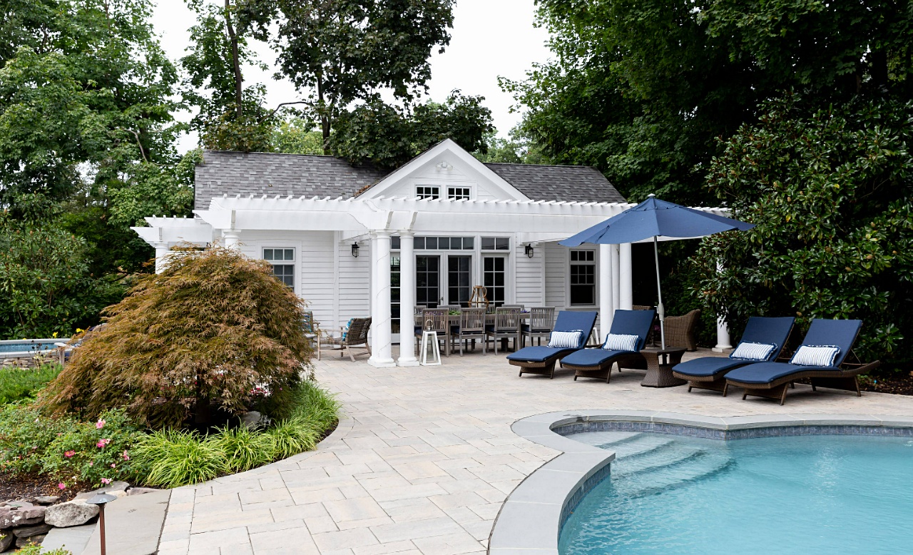 traditional in ground pool with patio