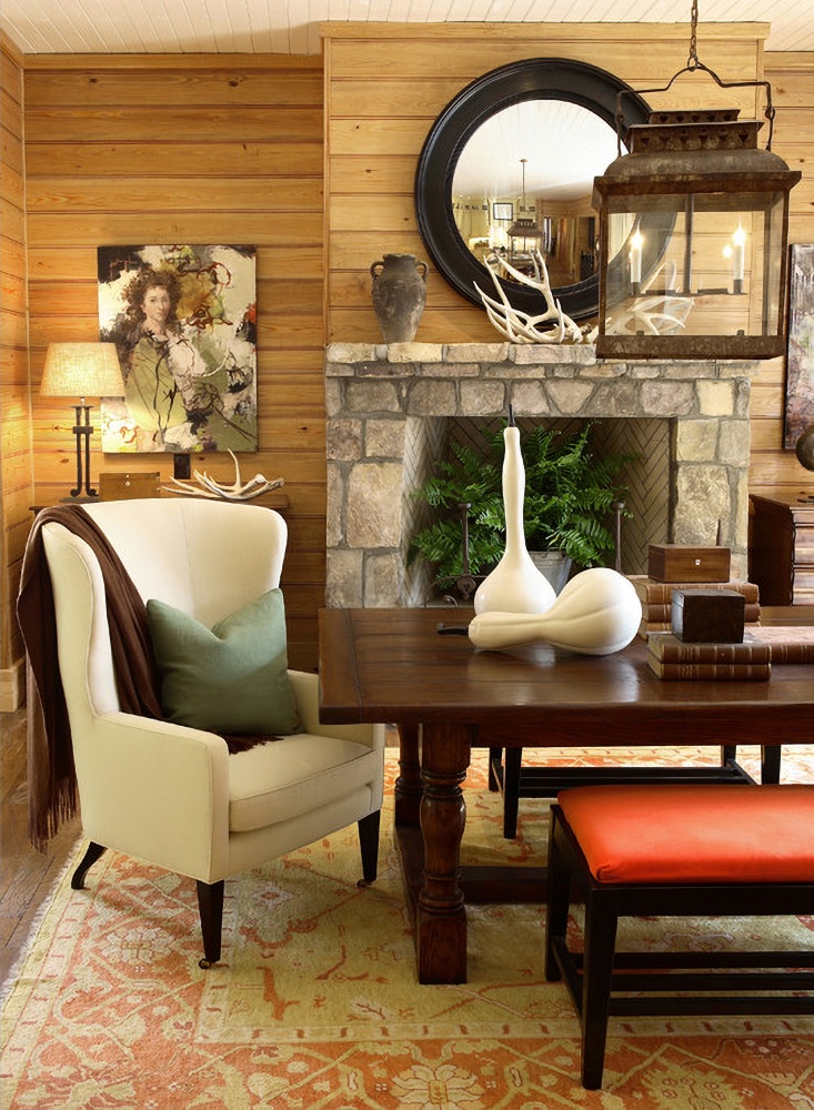 Country style dining room with stone fireplace