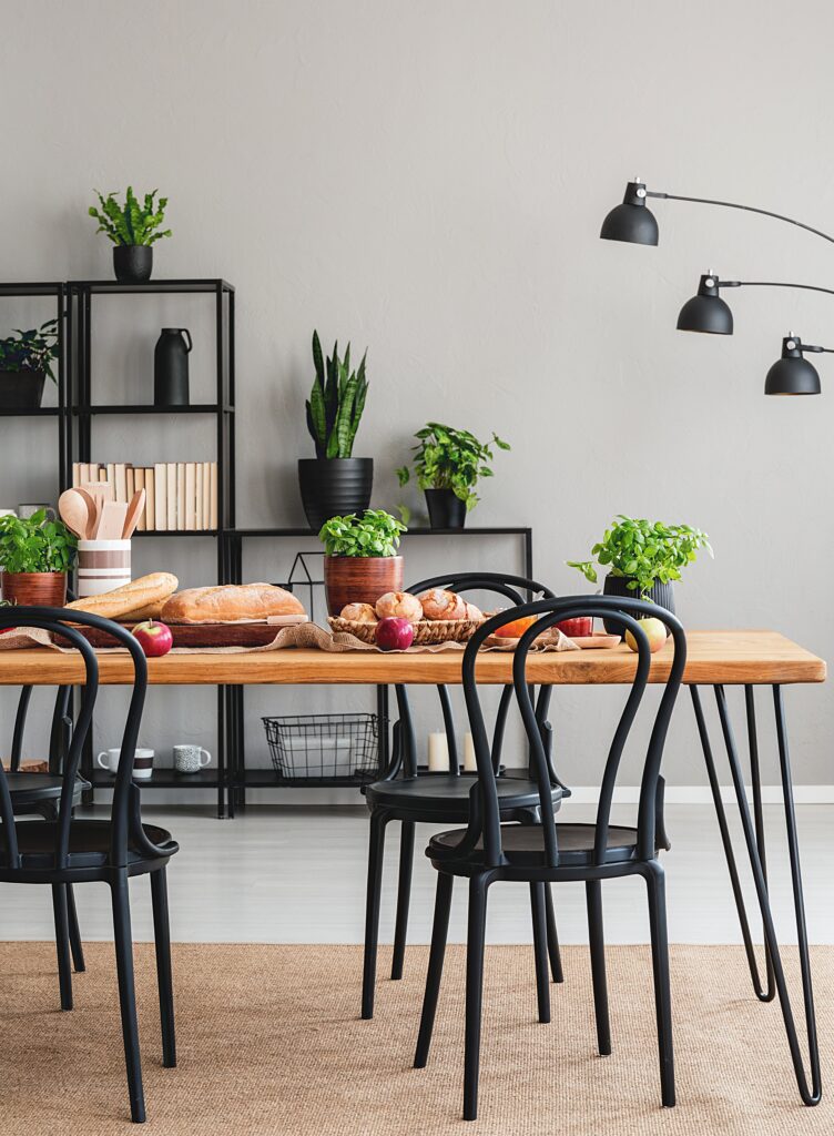 Black bentwood dining chairs with wood stained table