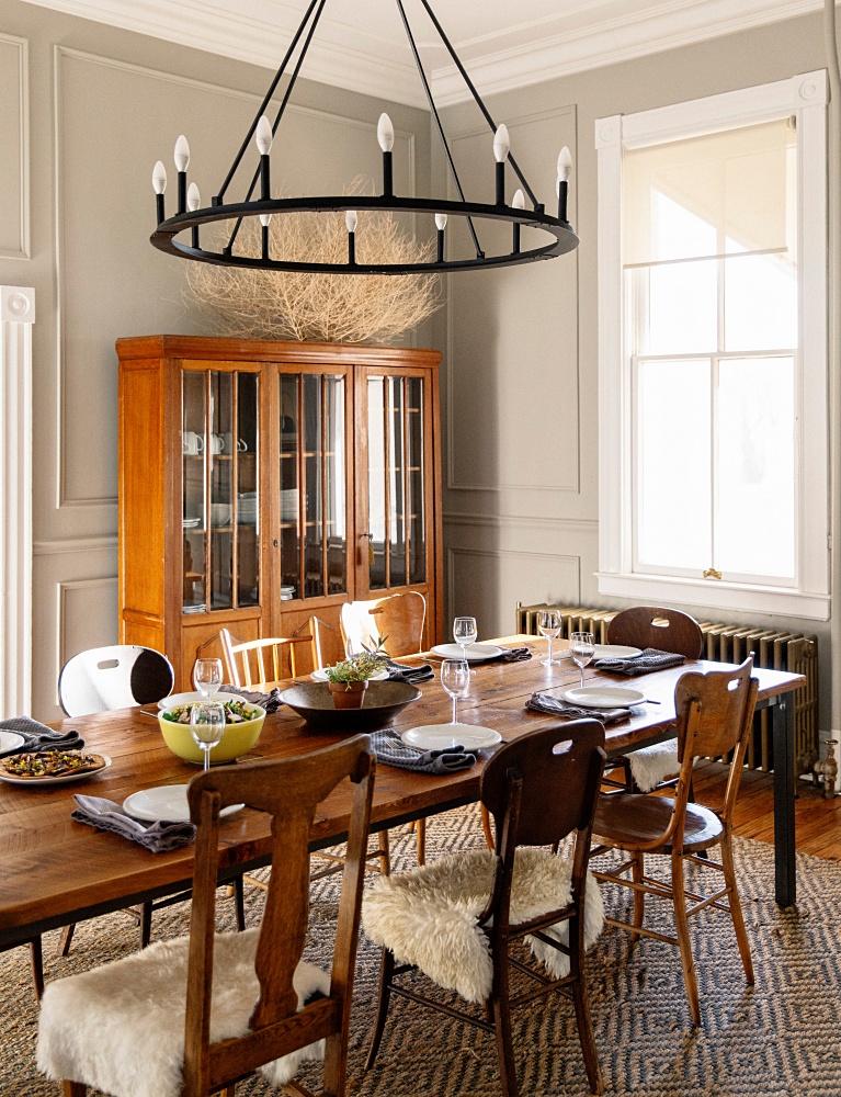 Dining room with mismatched chairs around the table