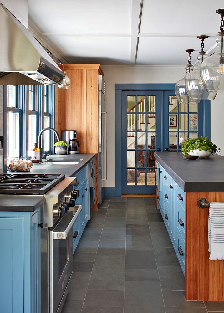 blue kitchen cabinets with wood accents