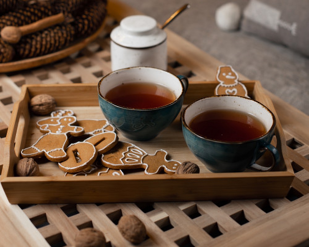 Gingerbread cookies on a tray with tea