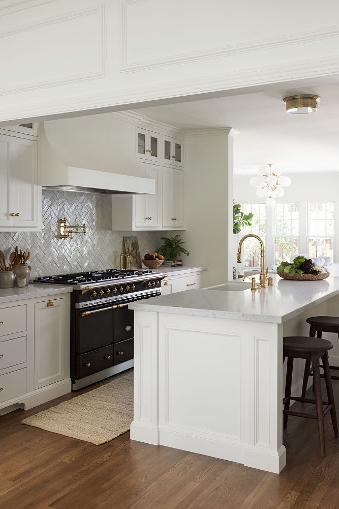 traditional white chef's kitchen with black, professional range