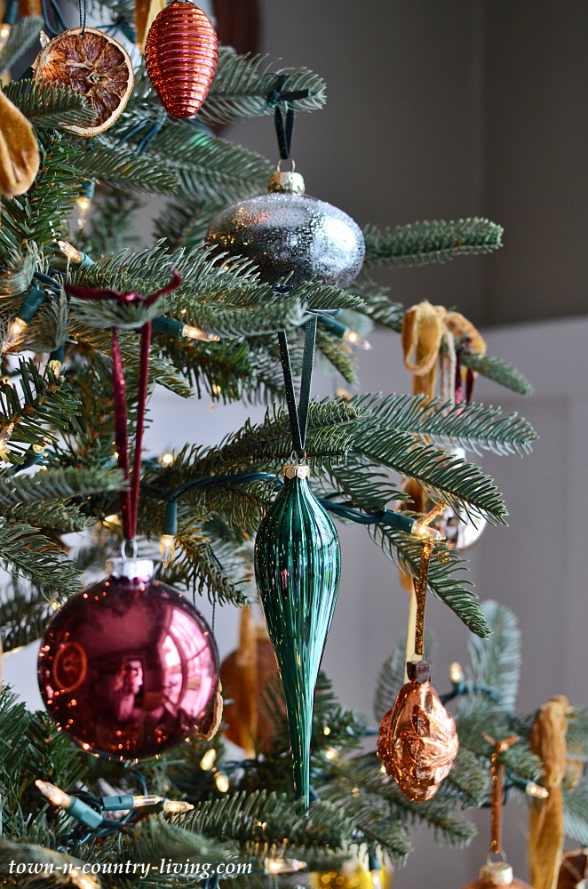 Green, brown, orange, and gold Christmas ornaments