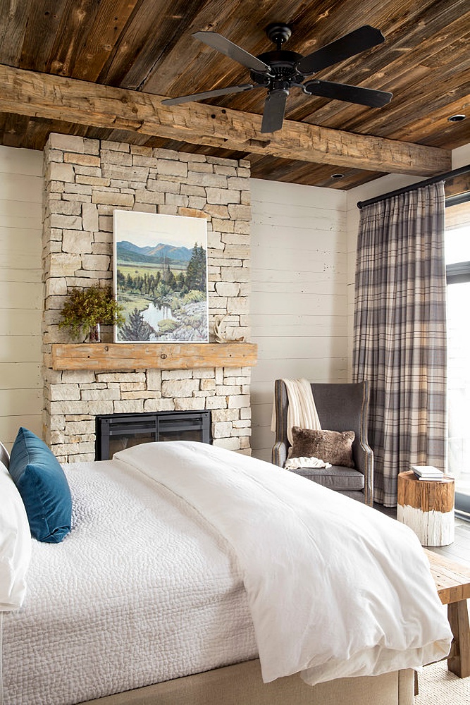 Master bedroom with stone fireplace