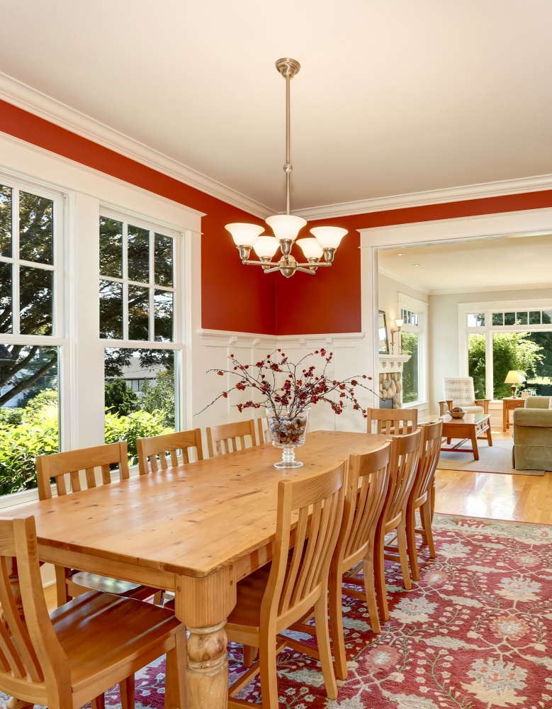 Red tones interior of American classic dining room. 