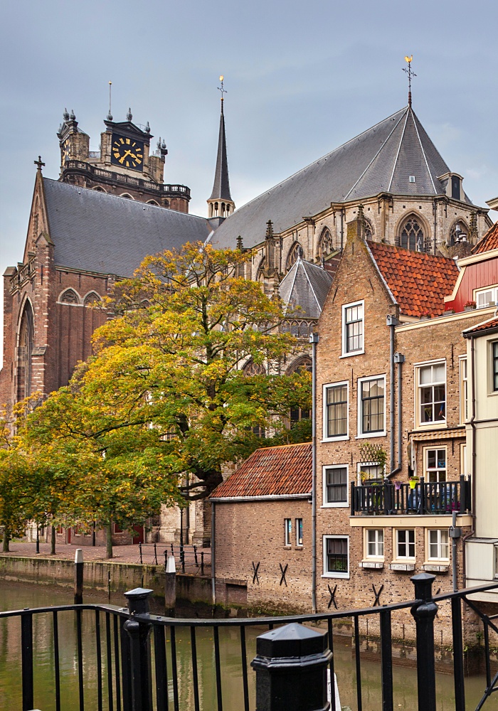 Pelserbrug bridge and historic canal houses along the Voorstraathaven with the church Grote Kerk in the background in Dordrecht 
