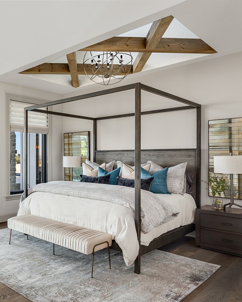 modern country bedroom with four poster bed