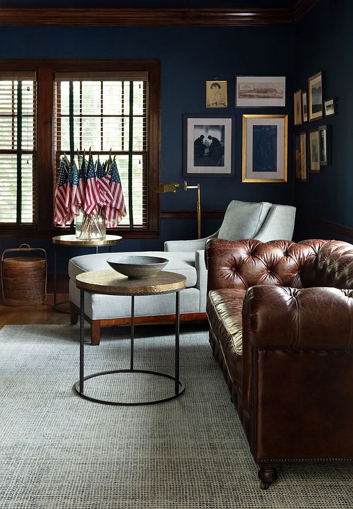 navy blue living room with leather sofa