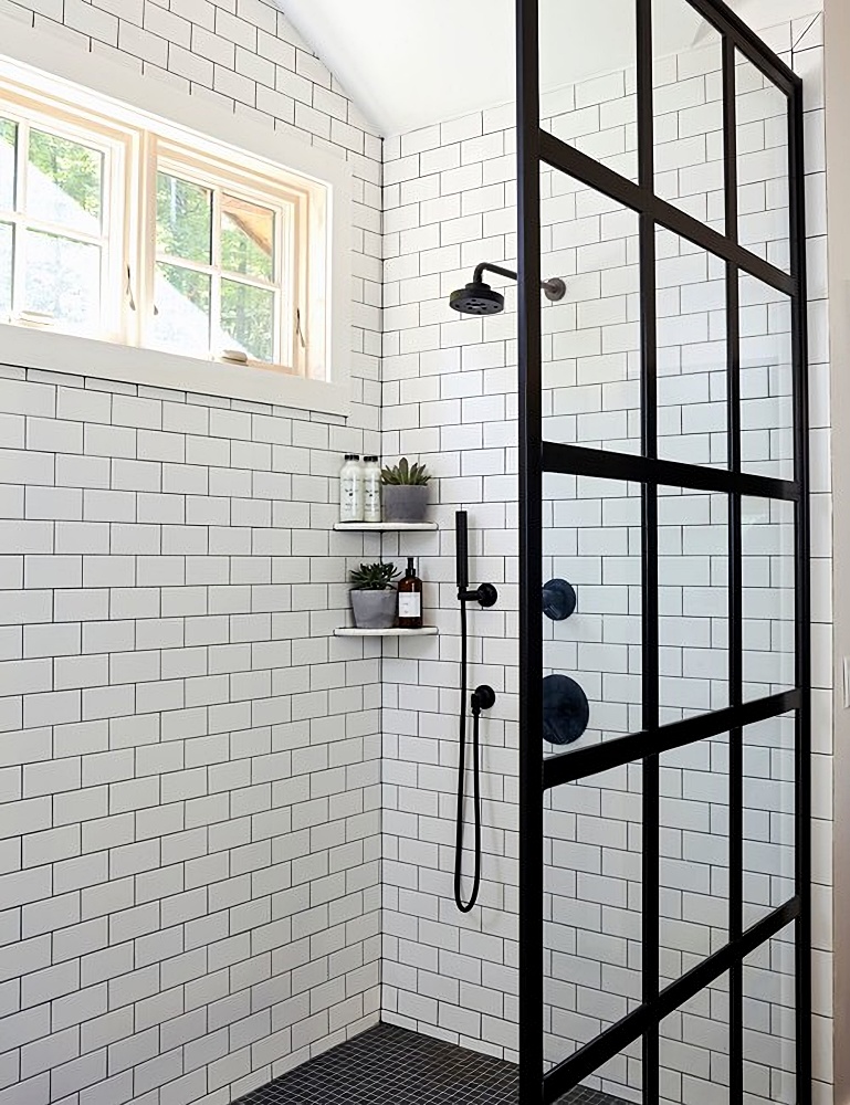 walk-in shower with windows and subway tile