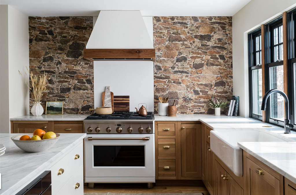A Fireplace and Stone Wall Add Unique Character to a Custom Kitchen