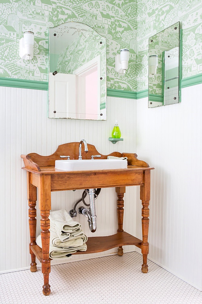 green and white vintage bathroom with bead board and wallpaper