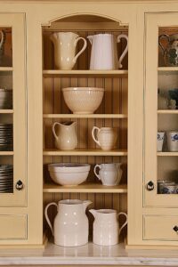 Kitchen cabinet with vintage pottery