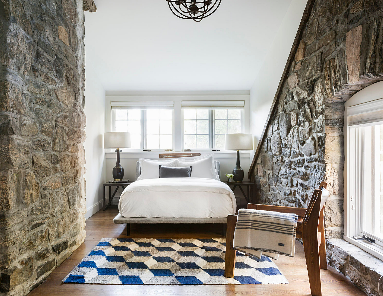 rustic cottage bedroom with stone walls