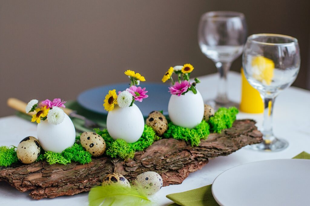 Colorful Easter centerpiece using bark and real eggs for vases