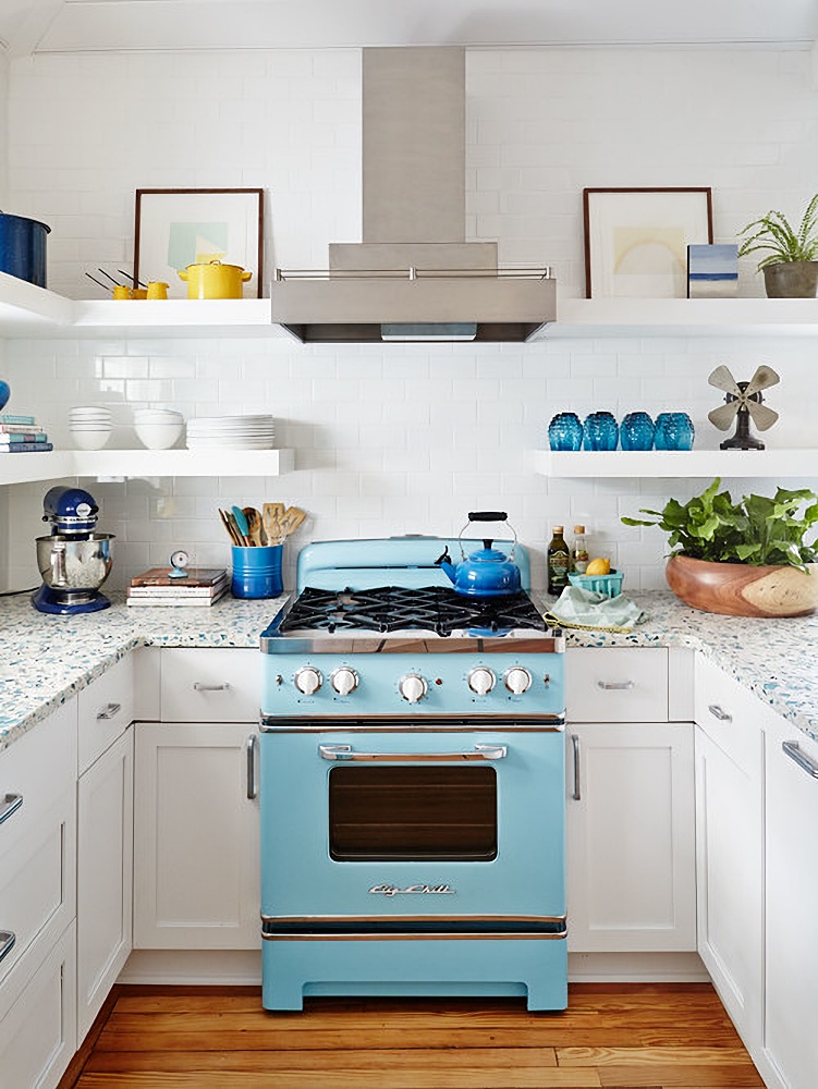 blue vintage stove in a seaside cottage kitchen