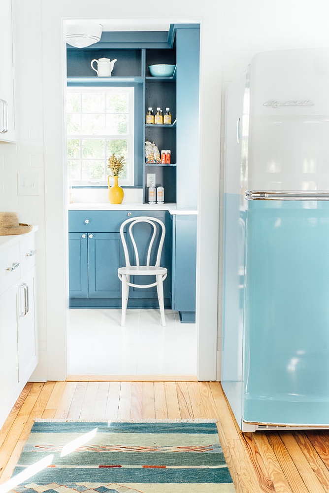 blue and white refrigerator in a coastal kitchen