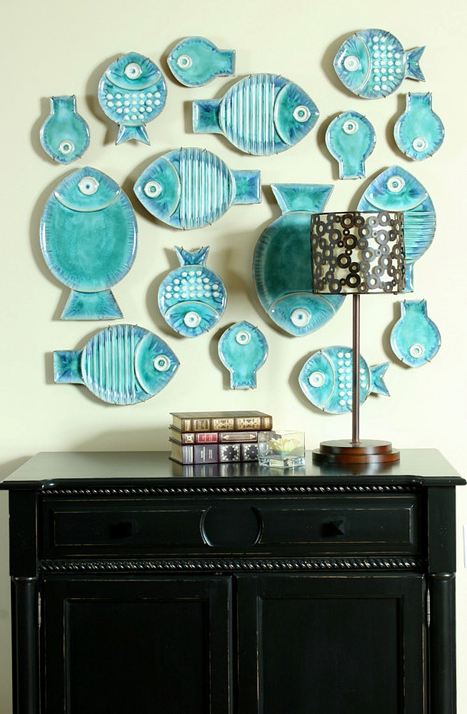blue fish plates hanging on wall as decoration