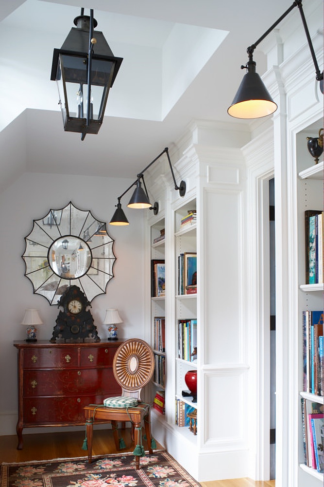 beach style hallway with built-in bookcases