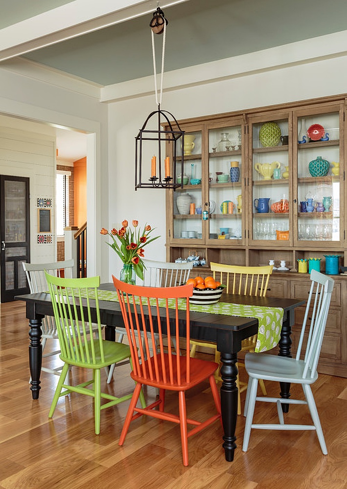 colorful painted Windsor chairs in dining room