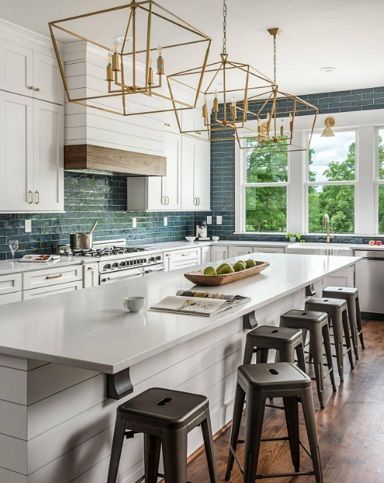 white kitchen cabinets with dark blue subway tile