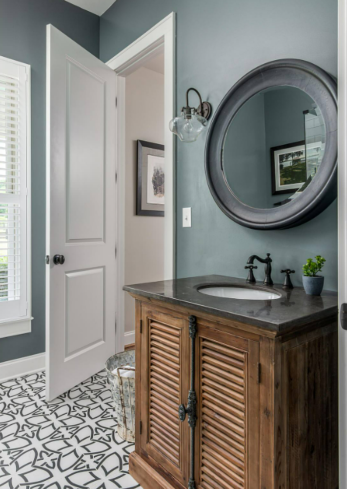 gray-blue powder room with patterned flooring