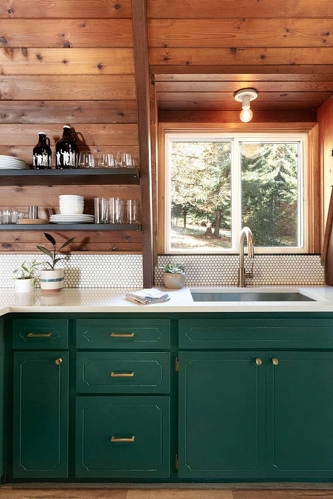 green and wood cabin kitchen
