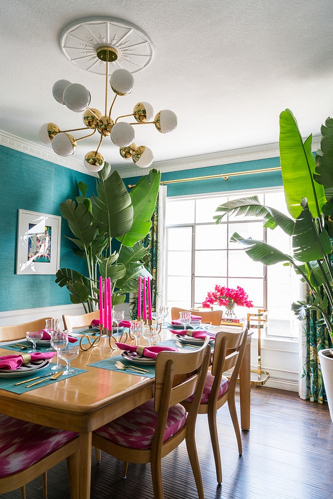 colorful dining room with palm plants