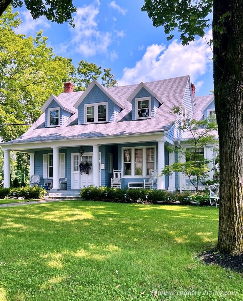 Blue Cape Cod home with front porch
