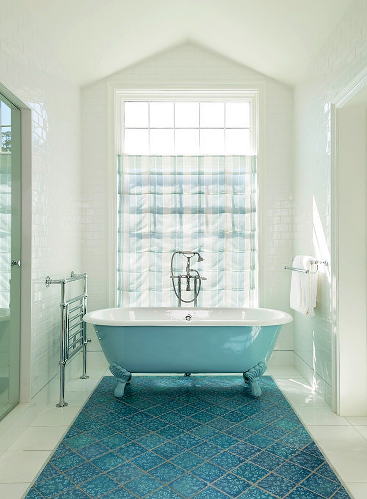 blue and white vintage style bathroom with claw foot tub