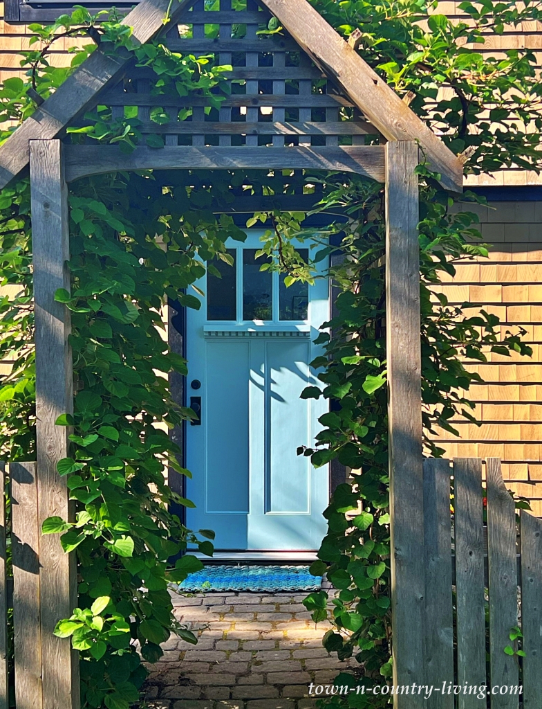 blue door on a Peak's Island house off the coast of Maine