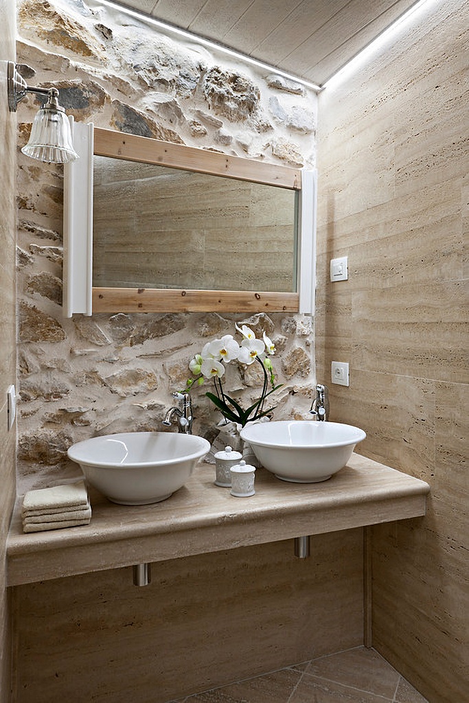 Rustic bathroom with wood and stone walls