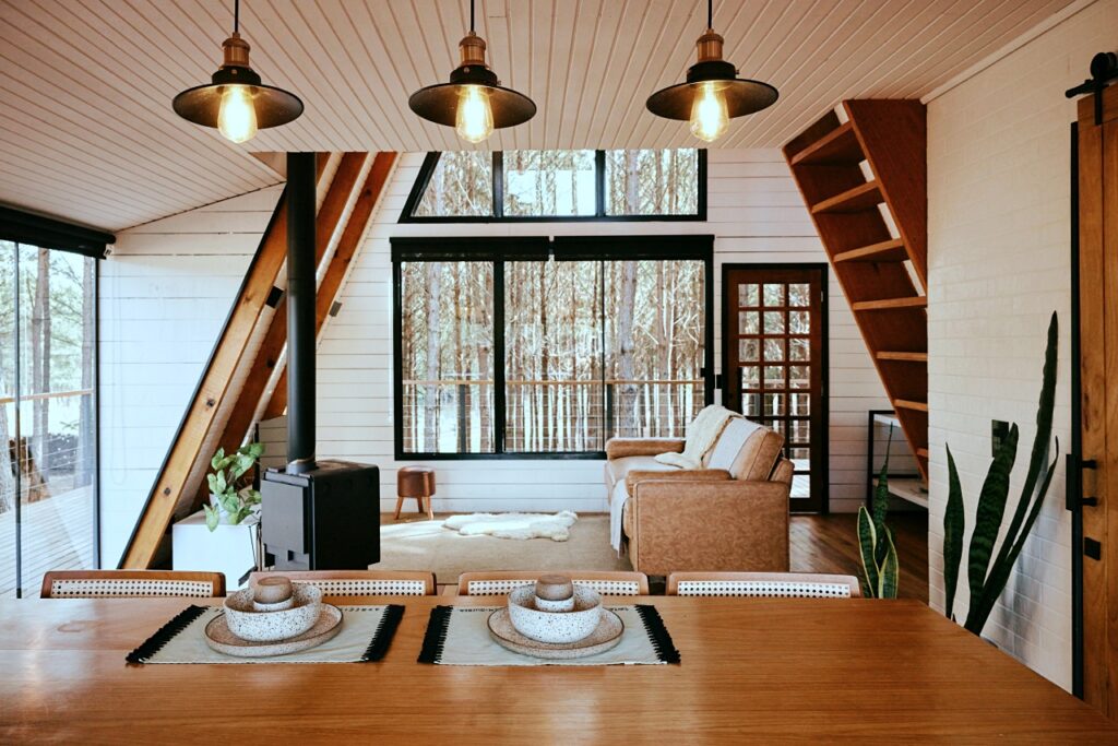 first floor of cozy a-frame cabin in the woods
