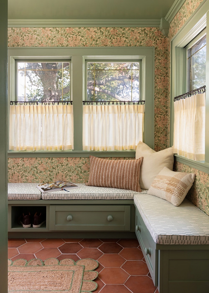wallpapered sun room with built-in window seat