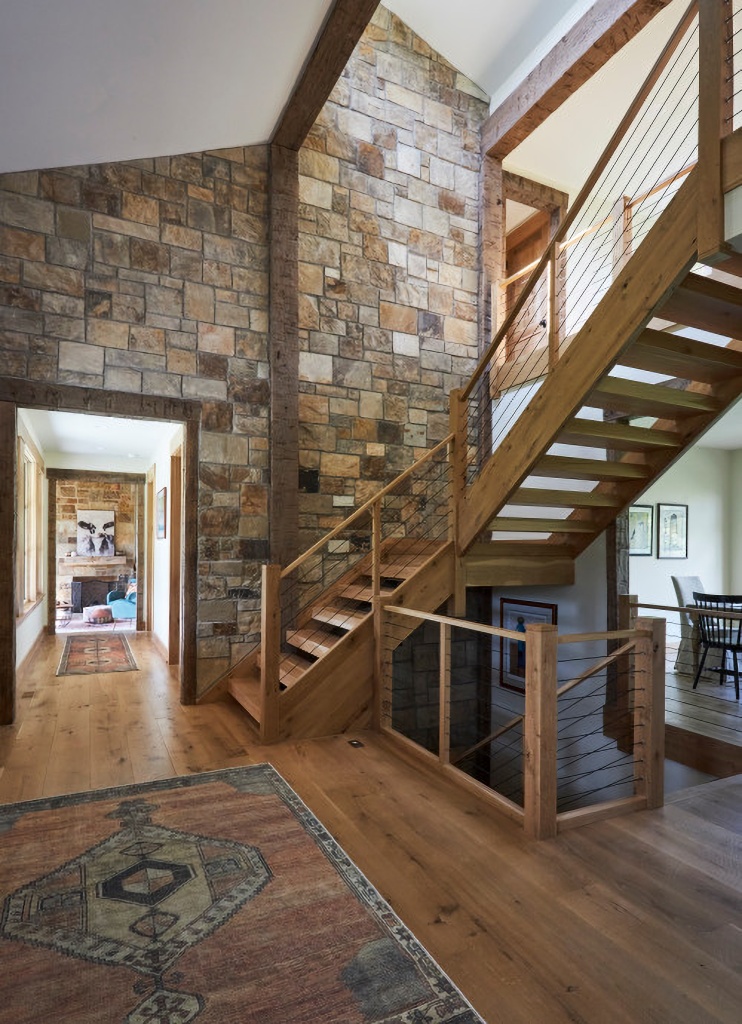 open rustic staircase in charming country estate