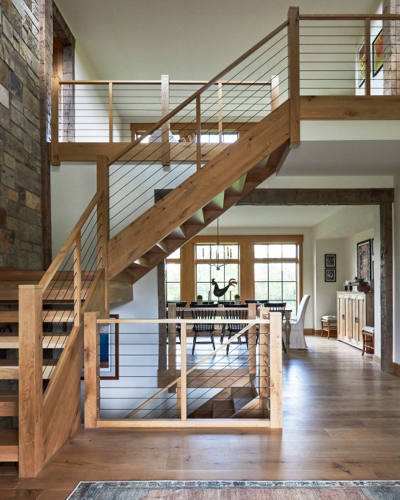 open rustic staircase in charming country estate